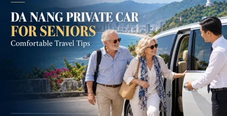 Senior couple beside a private car with a driver overlooking the Da Nang coastline